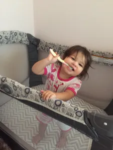 Young child brushing their teeth
